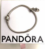 Full bracelet on Pandora box showing barrel clasp and spacers