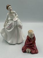 Front view of both figurines showing overall design and scale