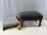 Both footstools side by side with green apple for scale