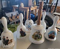Group shot of all six Norman Rockwell porcelain bells