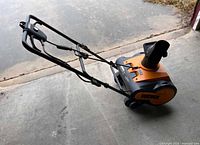 Full view Worx WG650 snowblower folded handle