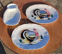 Group shot: two turkey platters and corn tray on table