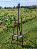 Front view of Viswin wooden easel standing outdoors