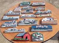 Overall view of all wooden shelf sitters spread on round table