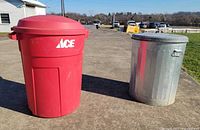 Red Rubbermaid trash can and galvanized metal trash can side by side outdoors
