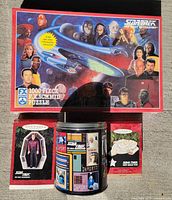 Overall lot showing TNG puzzle box, tin puzzle, two Keepsake ornament boxes