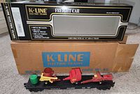 Flatcar with farm equipment loads and both boxes