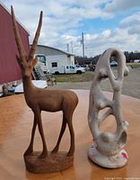 Both sculptures side by side for scale and comparison