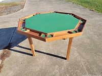 Full view of octagonal poker table standing