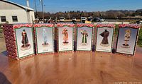 Front view of all six boxed figurines