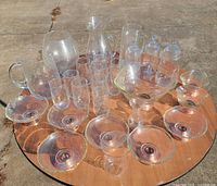 Full lot overview showing pitchers, tumblers, apothecary jars, serving bowl, dessert bowls, goblet