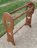 Front angled view of quilt rack showing heart cut-outs and overall form
