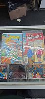 Top view of lot showing Beavis and Butt-Head and Veronica comics with five more underneath