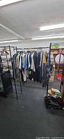 Front view of garment rack filled with men’s clothing