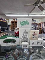 All seven Department 56 boxed items on display