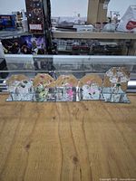 All five spun-glass figurines lined up