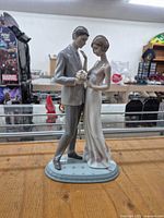 Front view of Lladro Declaration of Love figurine on wooden surface