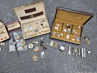 Entire assortment showing display boxes with cufflinks, tie bars and loose accessories