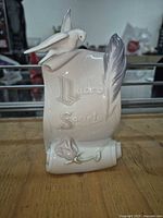 Front view of Lladró Collectors Society porcelain plaque with dove, feather and rose