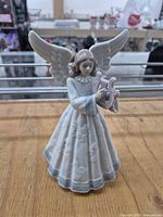 Front view of Lladro angel figurine with harp