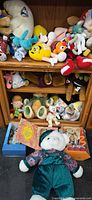 Wide shot of shelving with numerous plush toys visible