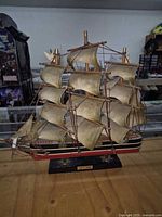 Full view of Cutty Sark model showing sails, hull, stand