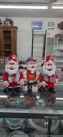 All three Gemmy hip hop animated Santas on display