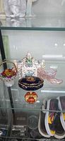 Overall lot showing trinket boxes, potpourri jar, glass slipper and basket