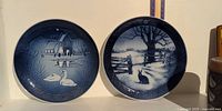 Two blue holiday collector plates