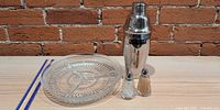 Full lot showing glass tray, cocktail shaker, salt and pepper shakers