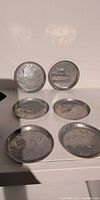 Six metal coasters with duck design