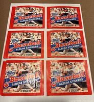 Front view of all six sealed 1983 Topps Baseball Album Sticker packs