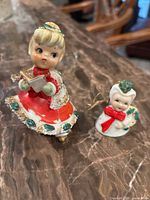 Front view of both ceramic bell ornaments