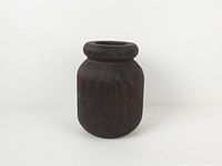 Front view of dark wooden vase upright