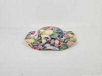 Top angled view showing overall hat shape and floral pattern