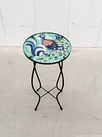 Side view of entire table showing glass top and metal legs