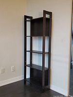 Front angled view of entire bookcase showing five shelves and side supports