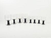 Front row view showing all eight Rosenthal Plus Black glasses