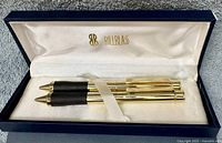 Pen and pencil inside satin-lined Bill Blass box