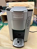 Front view of Cuisinart silver and black single-serve brewer