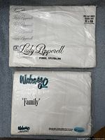 Front view of both sealed sheet packages showing brands and sizes