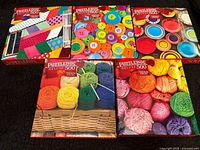 All five Puzzlebug Deluxe 500-piece puzzle boxes front view