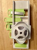 Mandoline slicer with blade inserts and food guard stacked together
