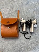 Binoculars and leather case overview