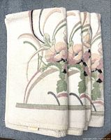 Four folded Springmaid pastel floral hand towels