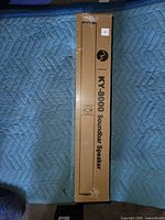Front of sealed box showing KY-8000 Soundbar Speaker branding