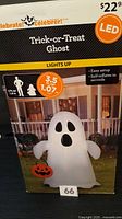 Front of sealed retail box showing Celebrate Trick-or-Treat Ghost inflatable