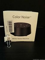 Front of sealed retail box showing product image and Color Noise branding