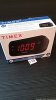 Front of sealed Timex alarm clock retail box showing product image and features