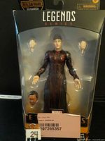 Front view of sealed Druig figure in package with accessories visible